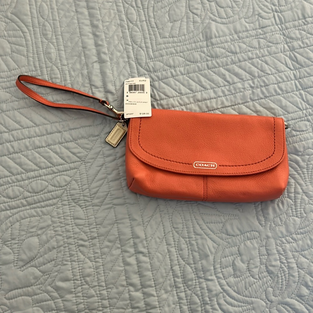 NWT Coach large flap wristlet.